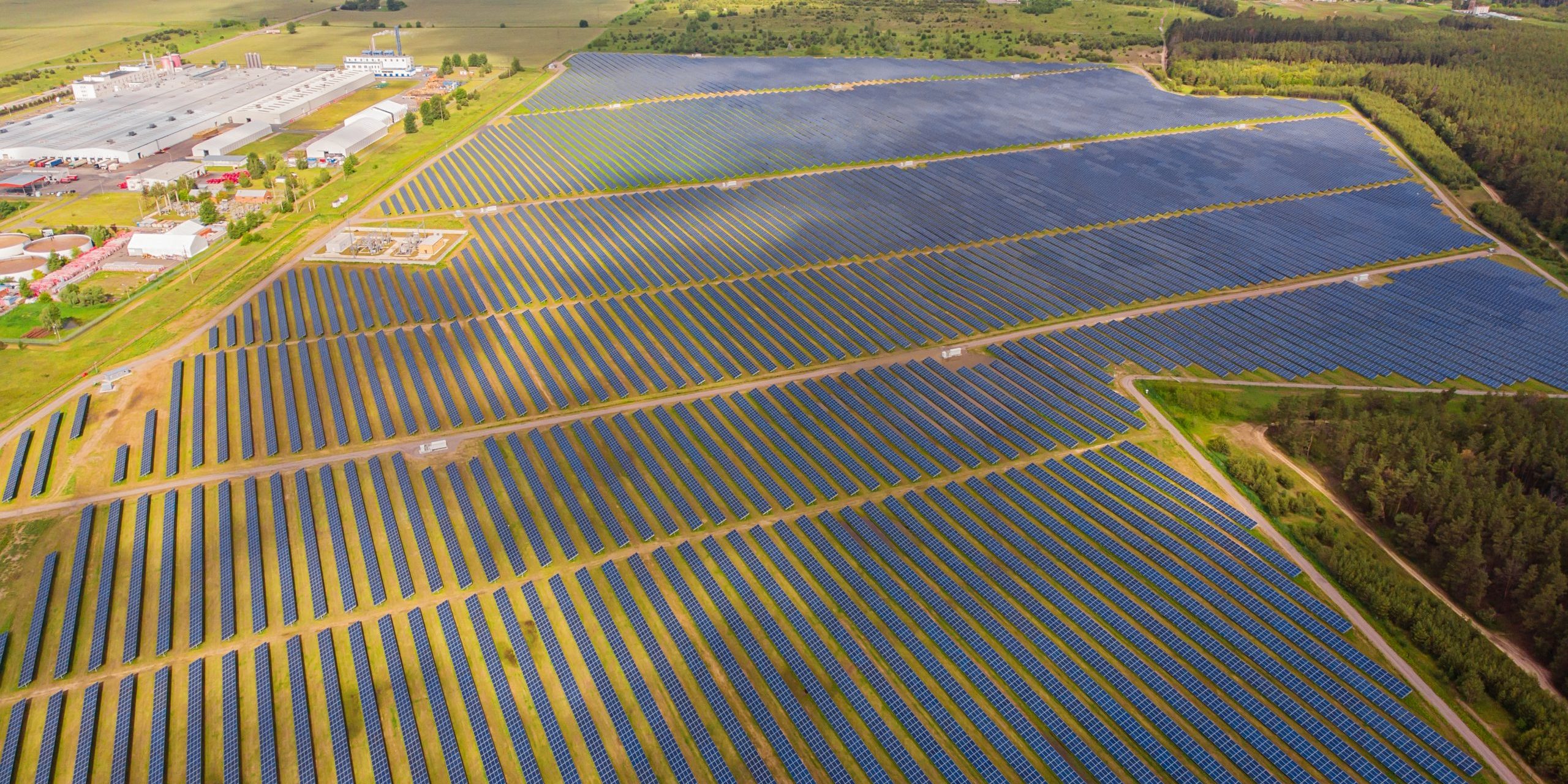 Solar power plant in the field. Aerial view of Solar panels.